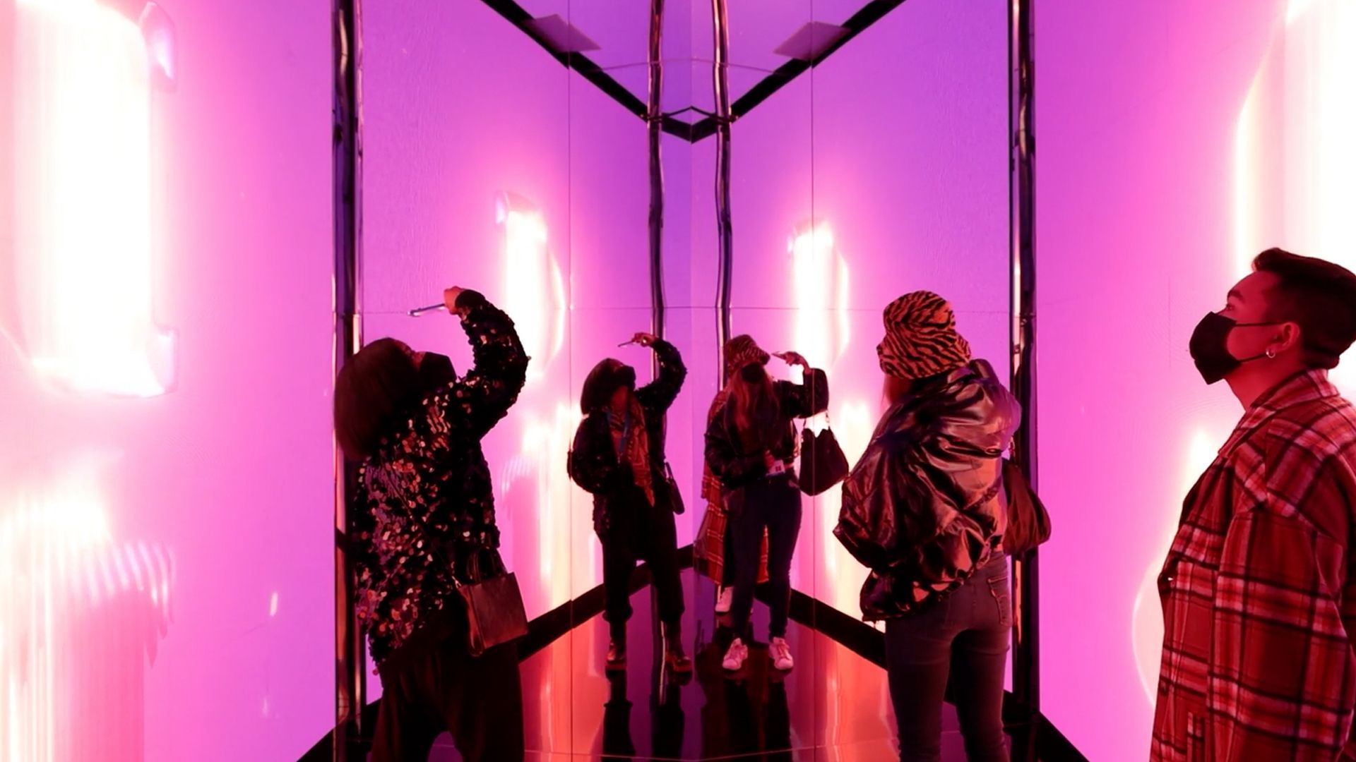 A group of people experiencing the Infinity Room at CES 2022.